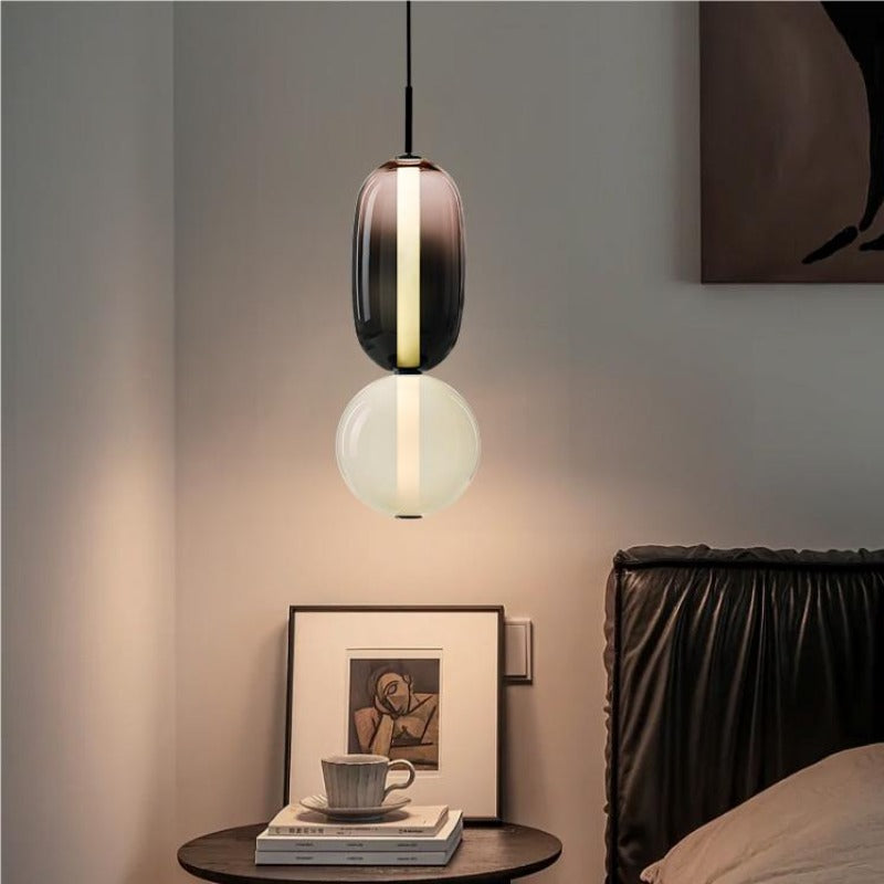 Syro LED-Pendelleuchte aus bonbonfarbenem Glas