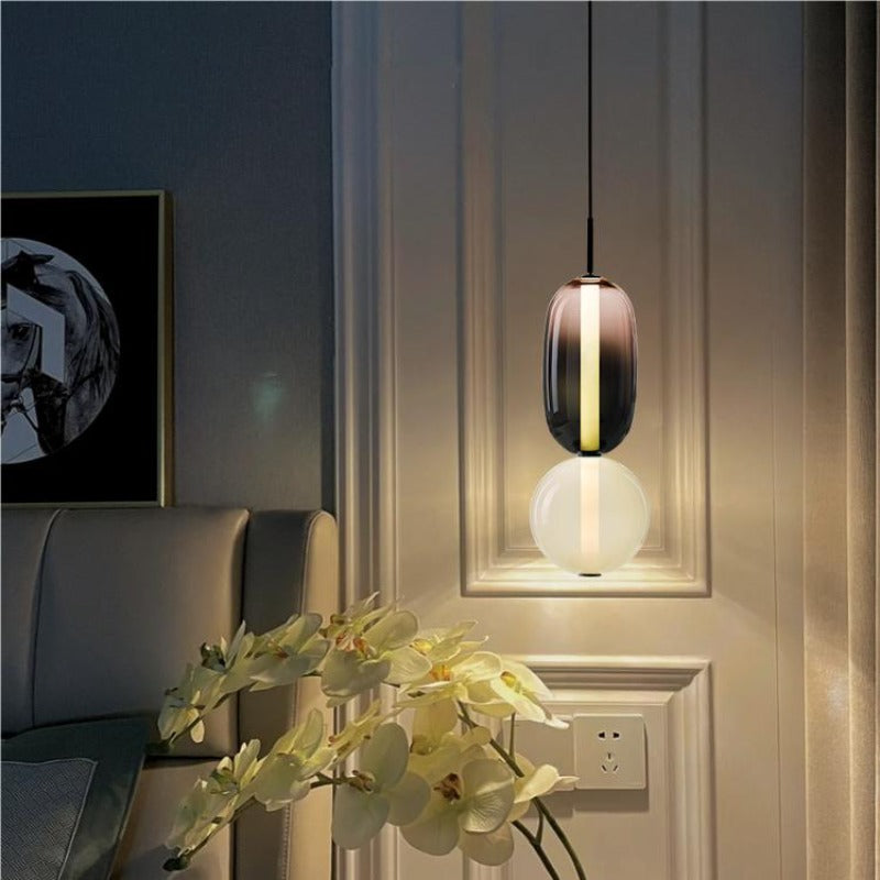 Syro LED-Pendelleuchte aus bonbonfarbenem Glas