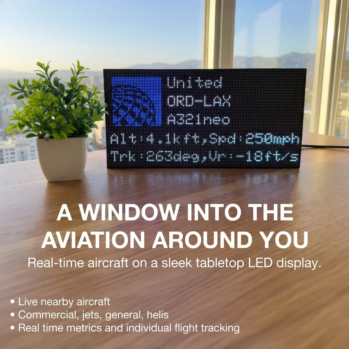 FlightWall - Mini display showing aviation information with a plant and window view in the background