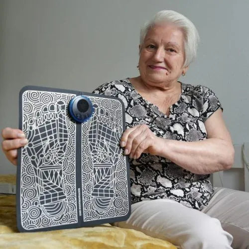 Woman holding up the foot mat showing the foot outline pattern
