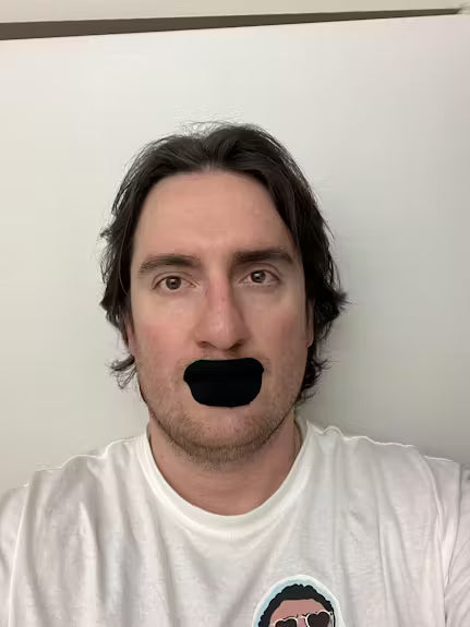 Man wearing a mouth tape strip before bed