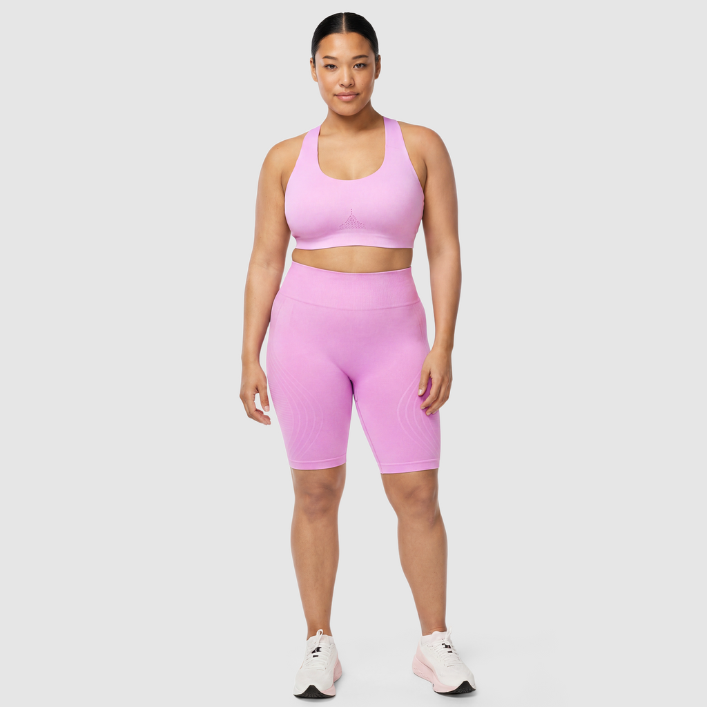 Woman wearing Sculpt 3D™ anti-cellulite shorts in pink, front view, high-waisted fit