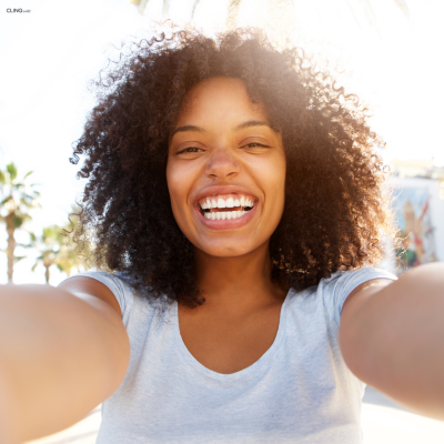 Happy woman taking a selfie outdoors
