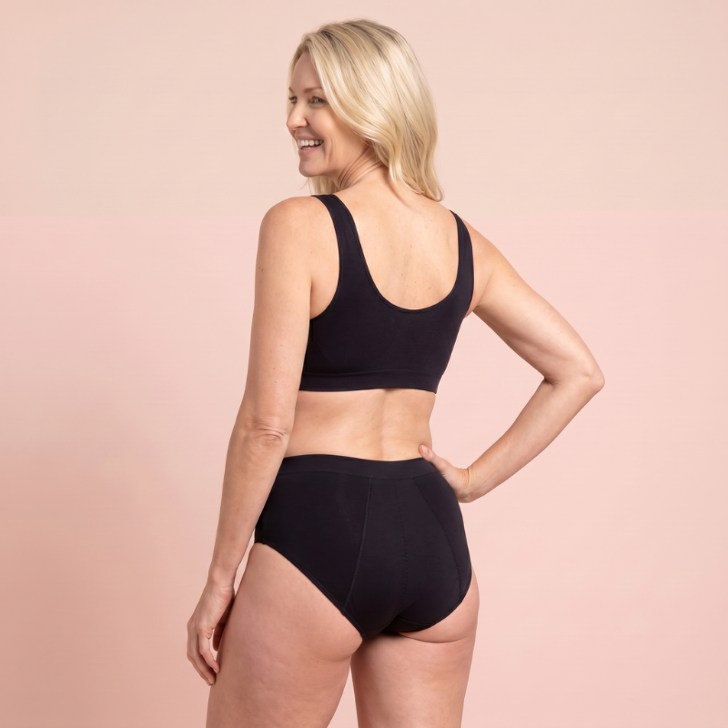 Back view of a woman wearing black bamboo briefs