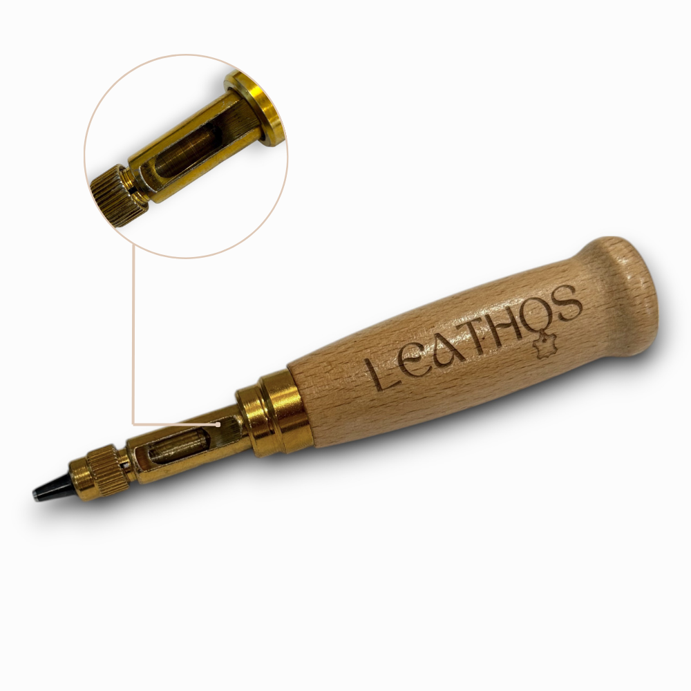 Wooden-handled leather hole punch with brass spring cutter head and close-up of the tip