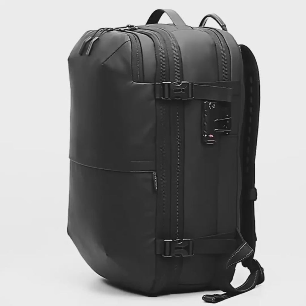 Front view of the matte black travel backpack