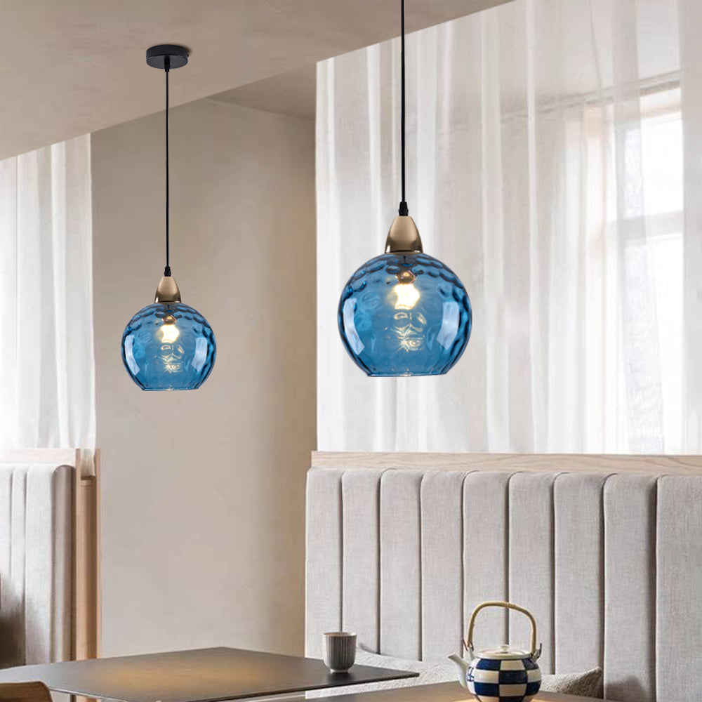 Pendellamper med vandringeffekt i globusformet glas