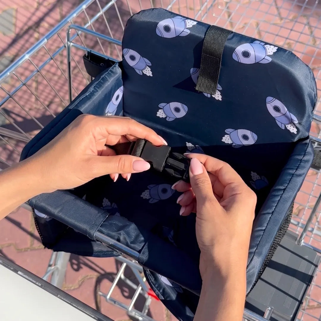 Parent closing the waist buckle on the seat in a cart