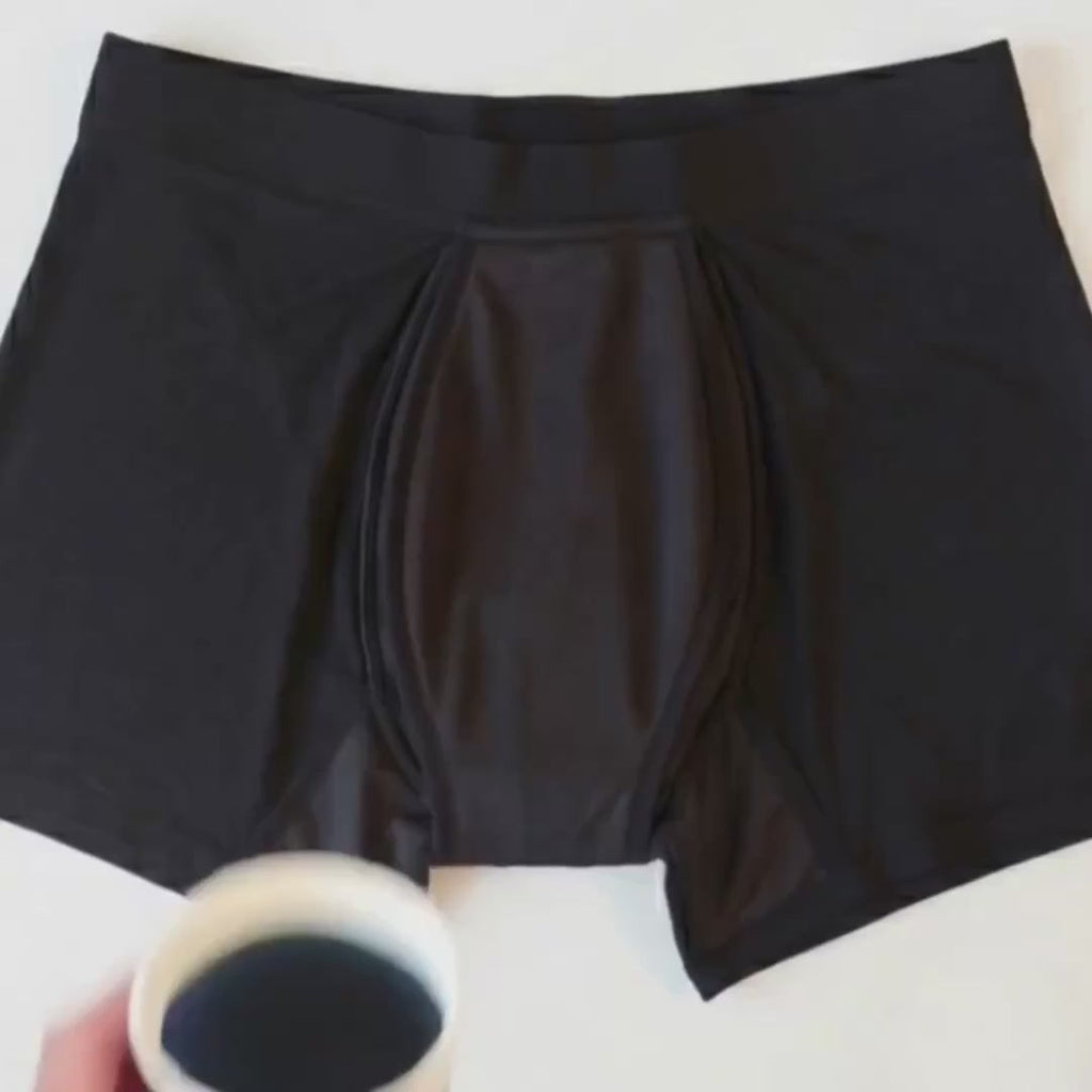 Absorbent layer of the boxer briefs taking in a poured liquid