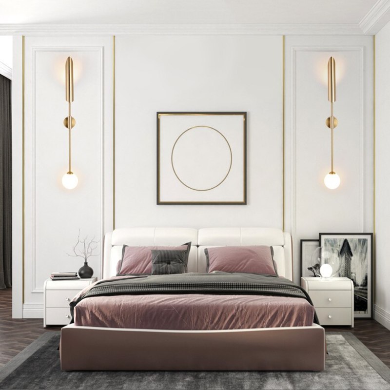 Phira gyllene vägglampa med dubbla huvuden i skidtuppsdesign