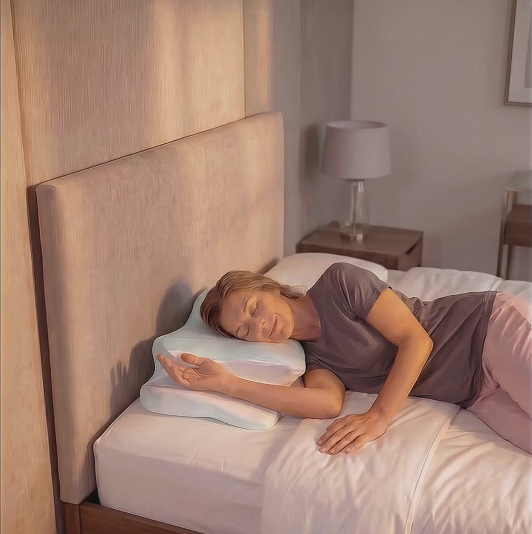 Woman resting on her side on the contour pillow in a bedroom