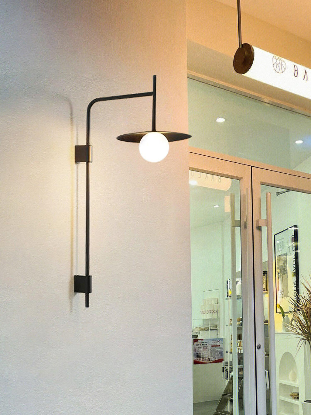 Gea Wandleuchte mit Schwenkarm und Stecksystem – geschwungenes Arm-Design, sanfte Beleuchtung