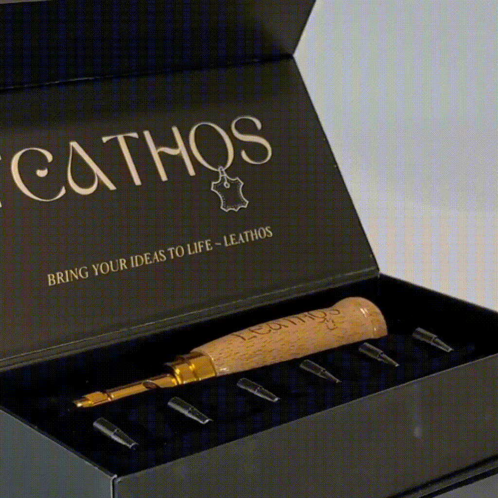 Hole punch and cutter tips laid in the open presentation box