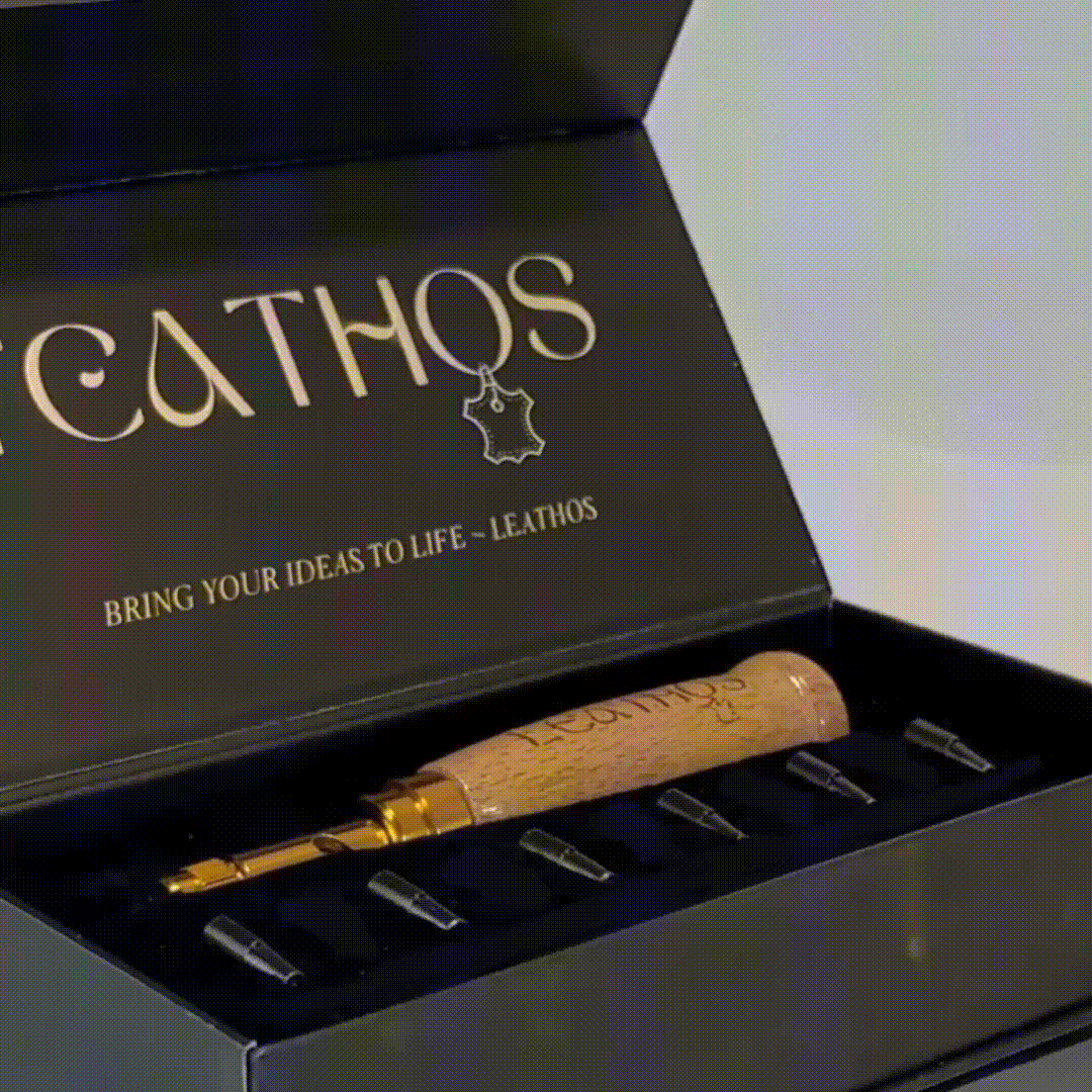 Hole punch and cutter tips laid in the open presentation box