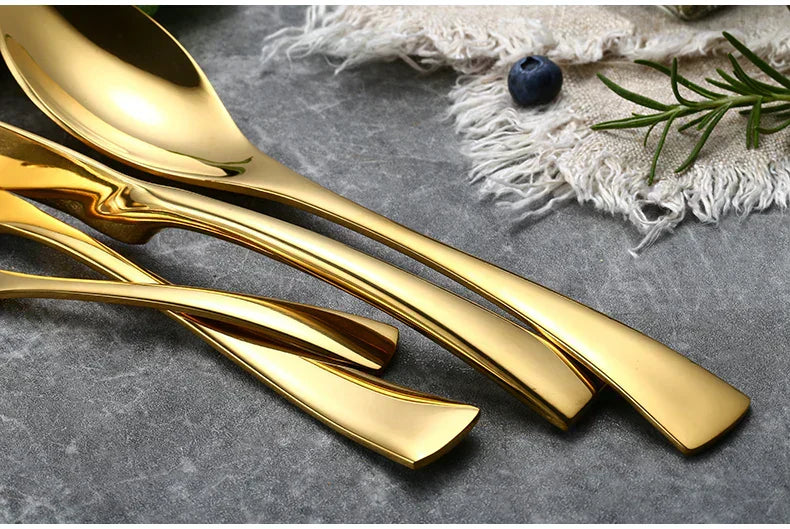 Aurora gull rustfritt stål bestikksett fra Orntli