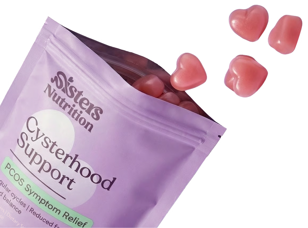 Open pouch with heart-shaped gummies falling out