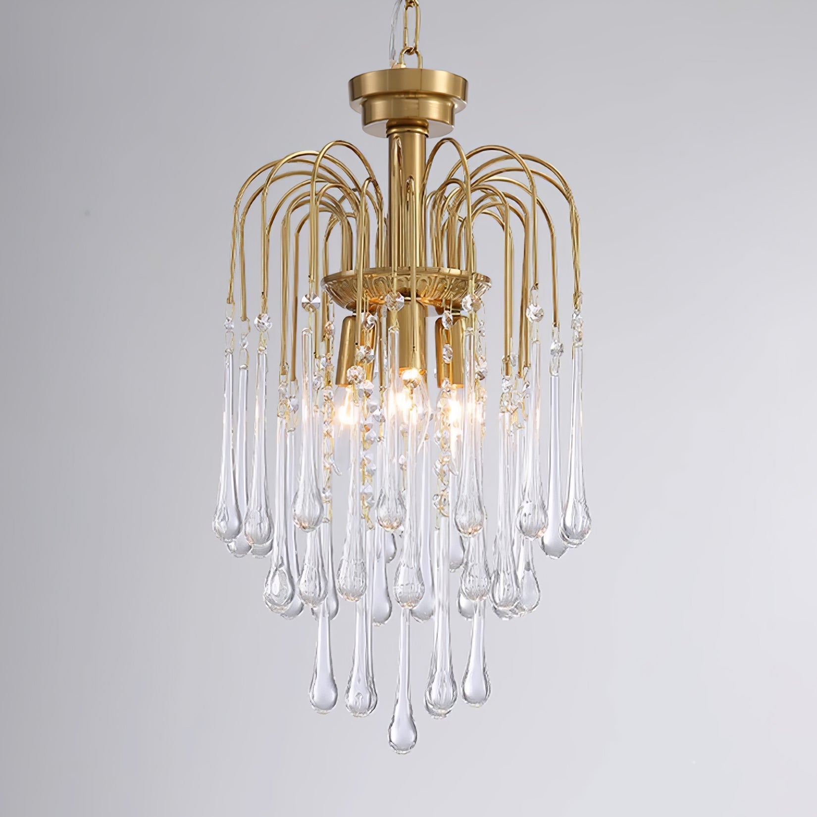 Lampadario Maltose — cascata di ottone e cristallo