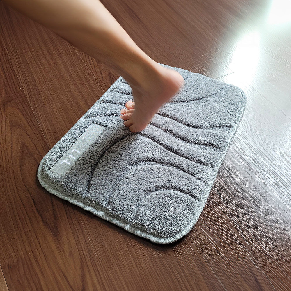 Foot standing on the rug to turn the alarm off