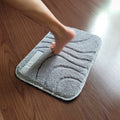 Foot standing on the rug to turn the alarm off