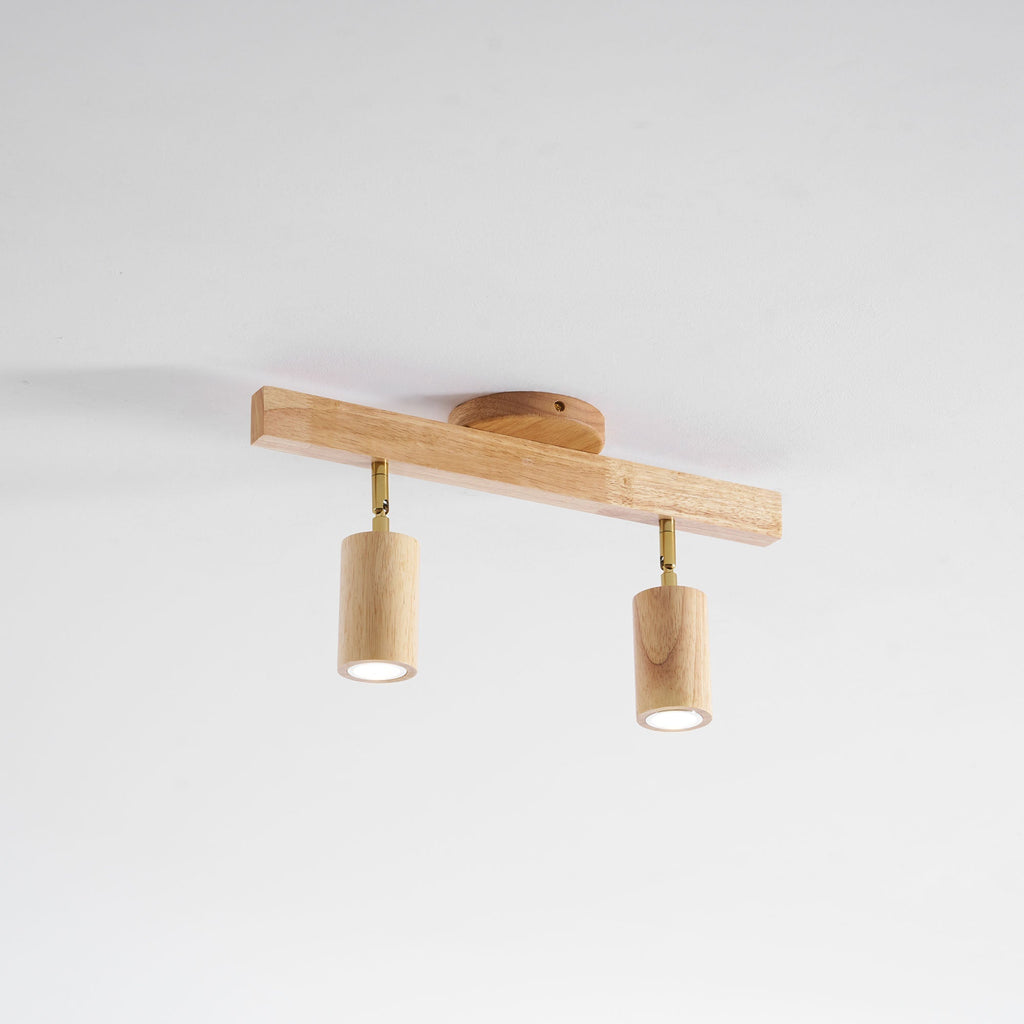 Schienenstrahler mit natürlichen Holzbalken