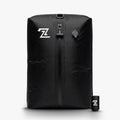 Black travel compression bag standing upright next to its small electric pump