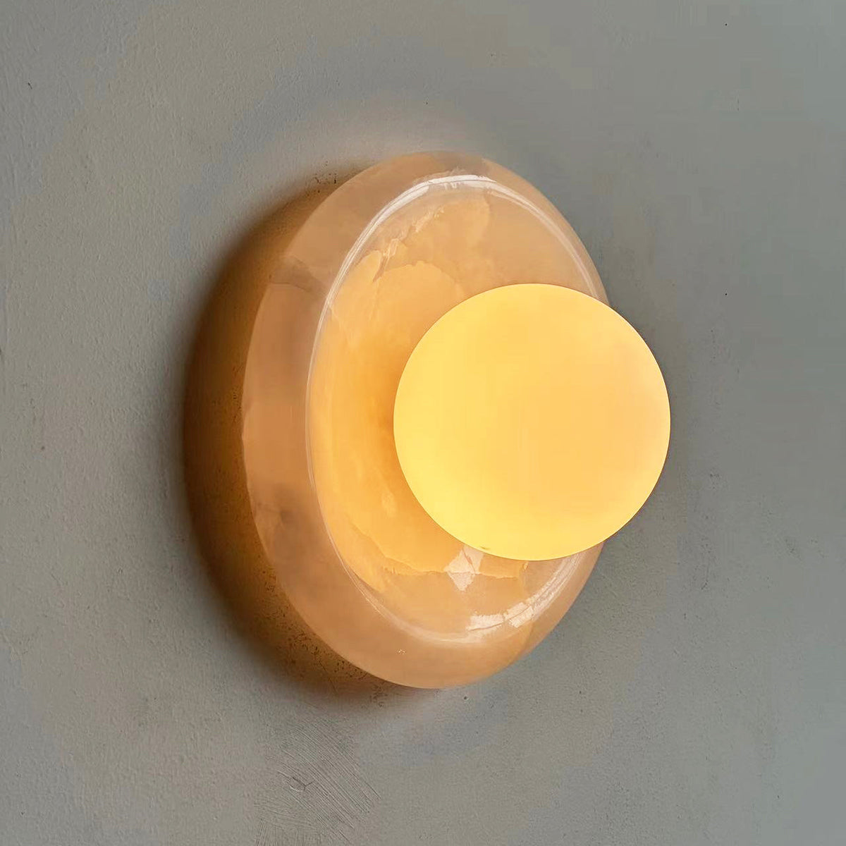 Avi Indoor Wall Sconce — Curved Marble Backplate, Round Design