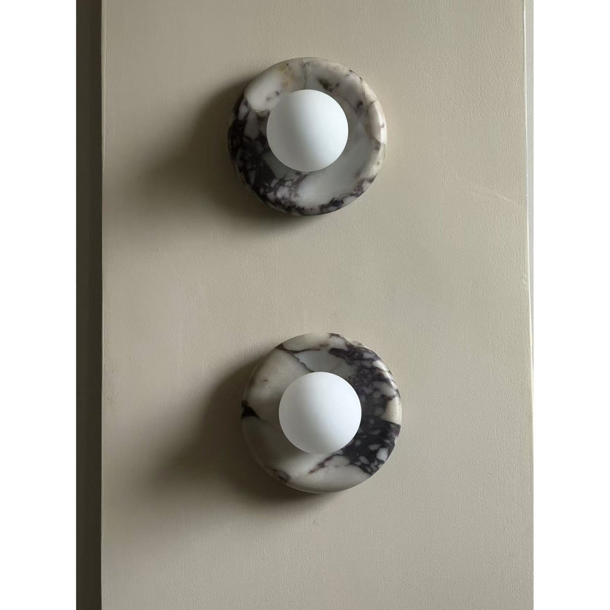 Avi Indoor Wall Sconce — Curved Marble Backplate, Round Design