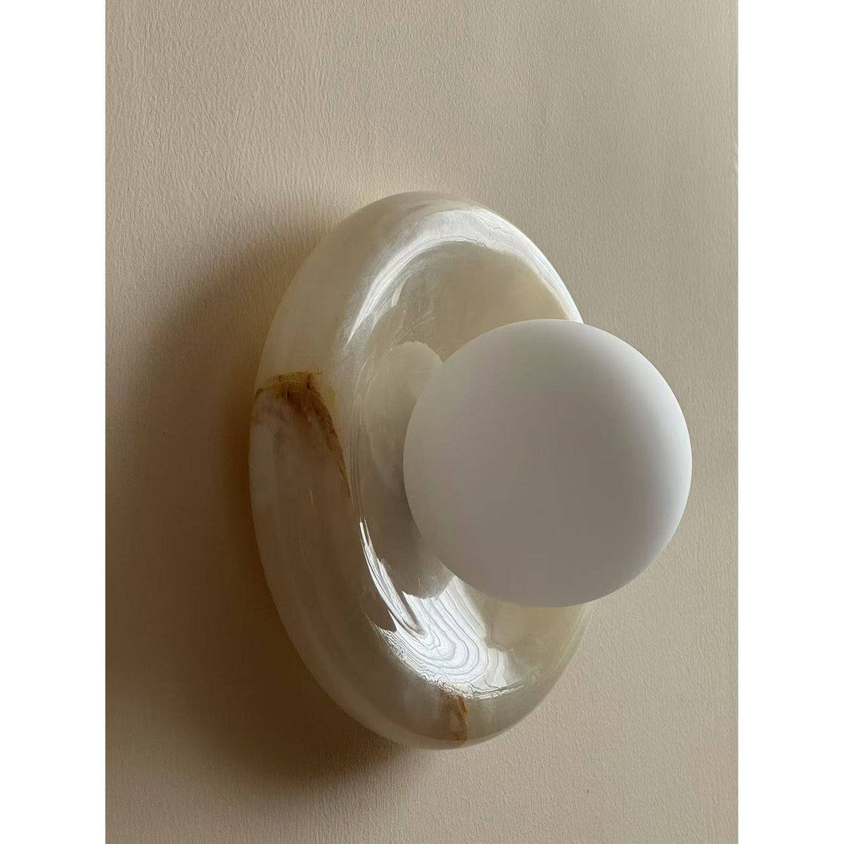 Avi Indoor Wall Sconce — Curved Marble Backplate, Round Design