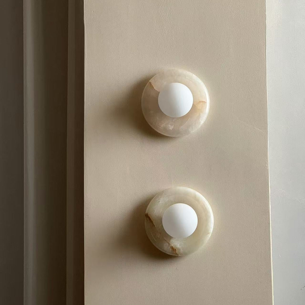 Avi Indoor Wall Sconce — Curved Marble Backplate, Round Design