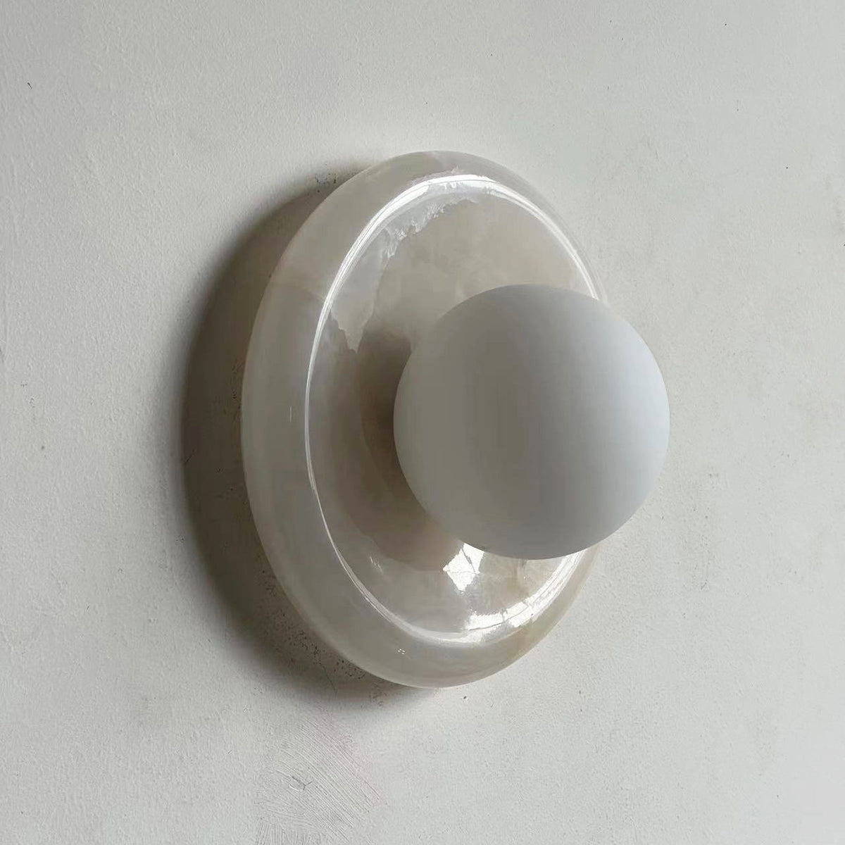 Avi Indoor Wall Sconce — Curved Marble Backplate, Round Design