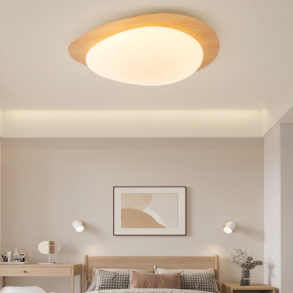 Metalowa plafoniera sufitowa o konturze kamyka