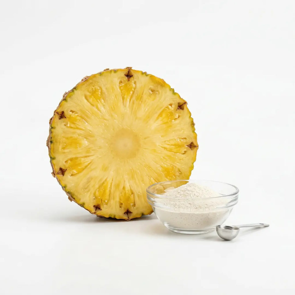 Halved pineapple next to bromelain powder