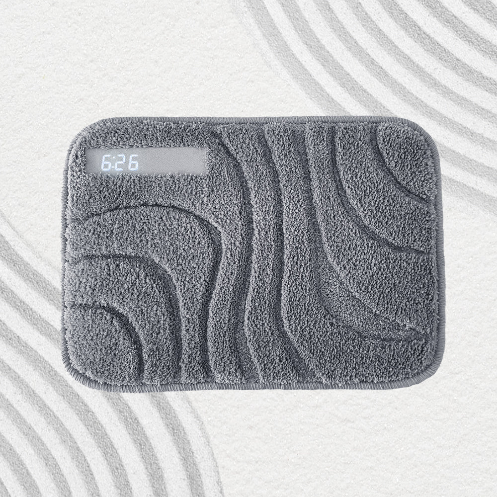 Top view of the grey wave-pattern alarm rug with LED display