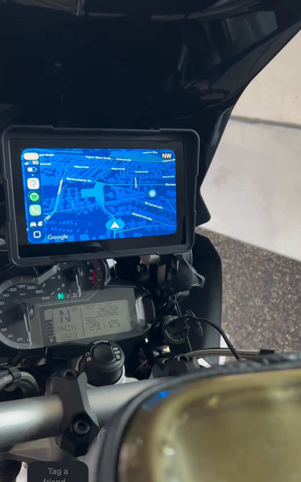 Display showing a map above the motorcycle dashboard