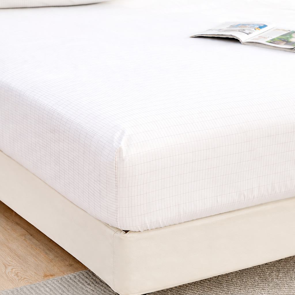 Grounding fitted bed sheet close-up showing the fabric texture and conductive surface detail.