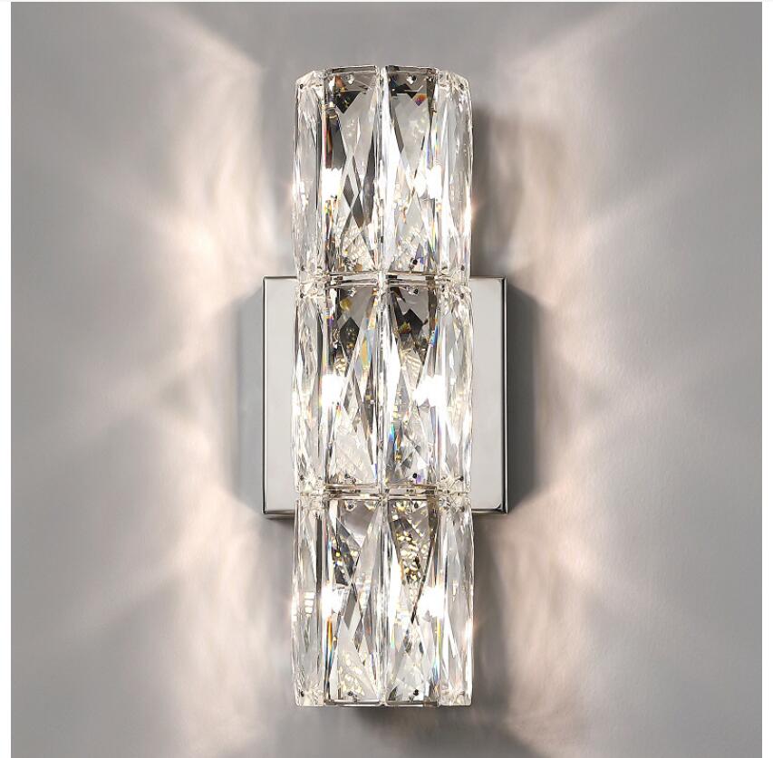 Applique da parete in cristallo con paralume trasparente e struttura in acciaio inox di Lumenara