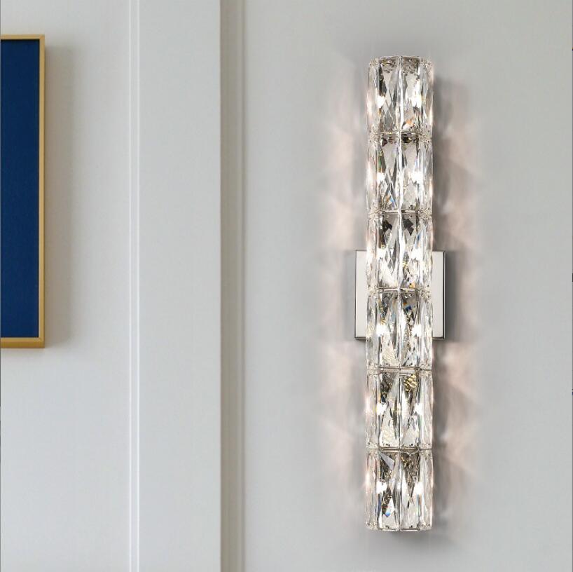 Applique da parete in cristallo con paralume trasparente e struttura in acciaio inox di Lumenara