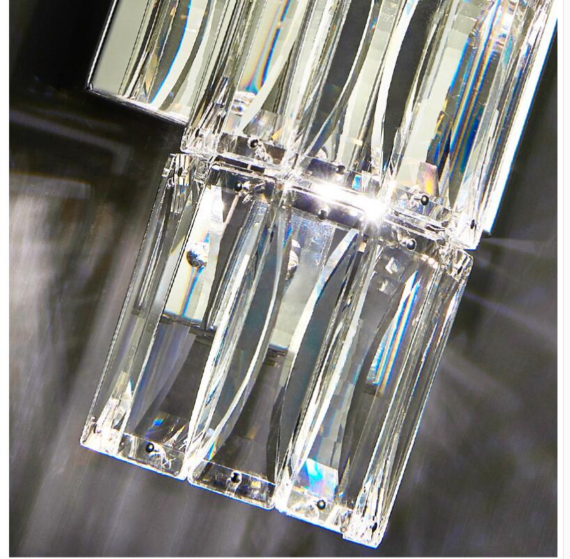 Applique da parete in cristallo con paralume trasparente e struttura in acciaio inox di Lumenara