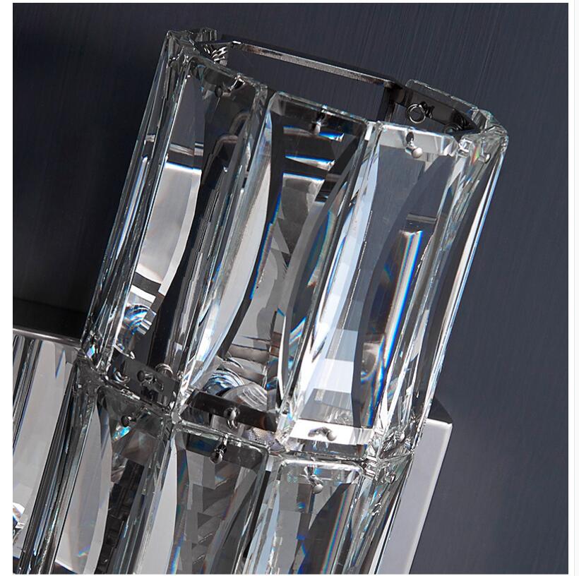 Applique da parete in cristallo con paralume trasparente e struttura in acciaio inox di Lumenara