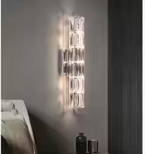 Applique da parete in cristallo con paralume trasparente e struttura in acciaio inox di Lumenara
