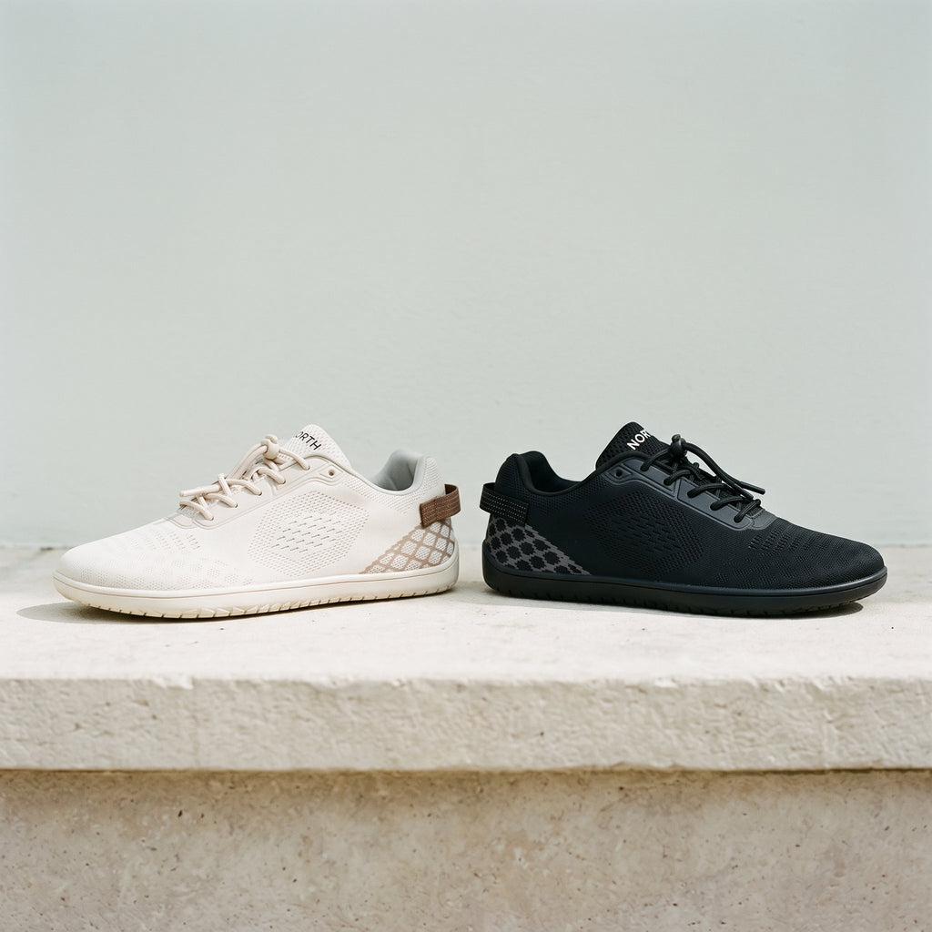 Beige and black versions of the sneaker side by side on a stone ledge