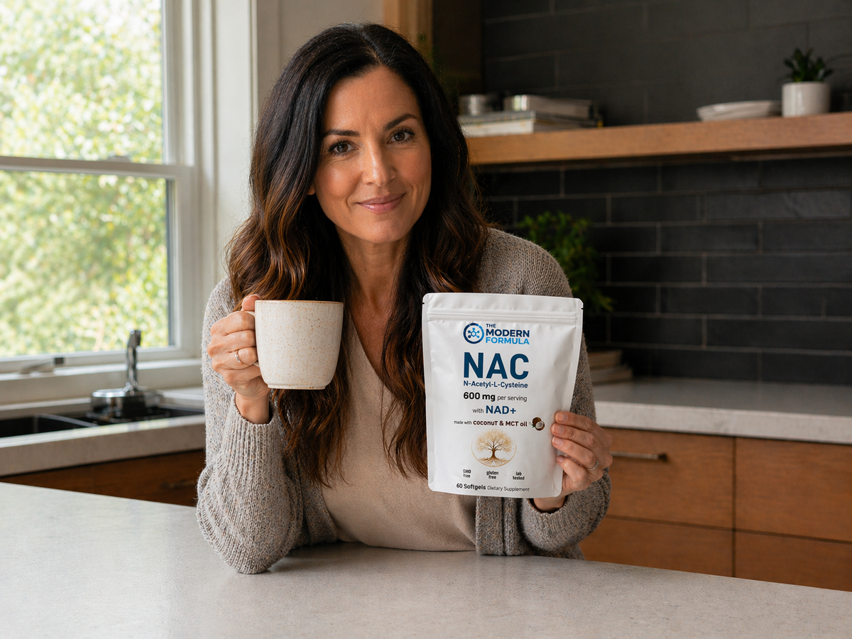 Woman with a cup of coffee and the pouch at the kitchen table