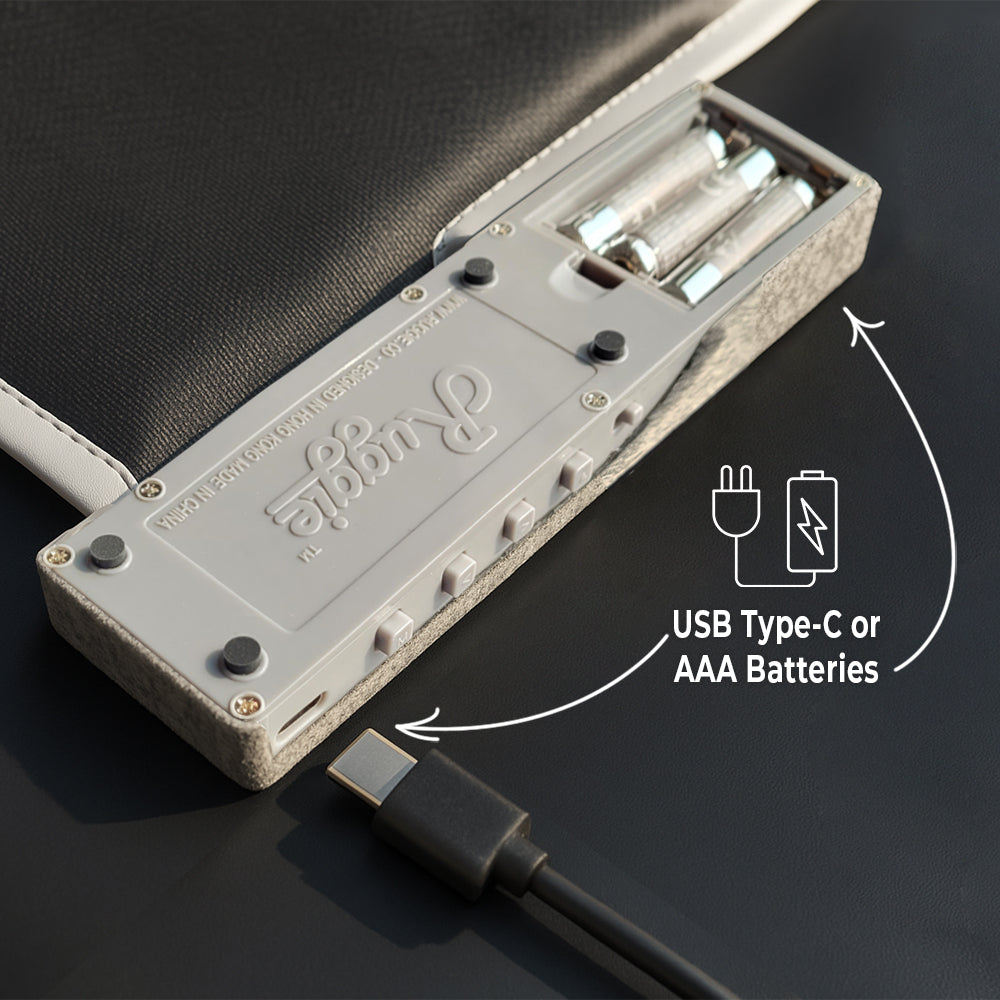 Battery compartment and USB-C port underneath the alarm rug