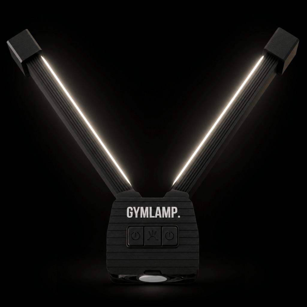 Gym light glowing with both arms open in the dark