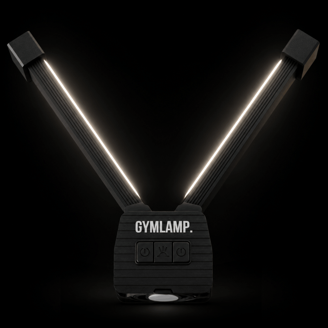 Gym light glowing with both arms open in the dark