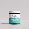 Jar of soothing massage lotion on a light grey background