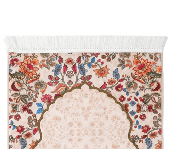 Close-up of the floral border and arch design of the prayer mat