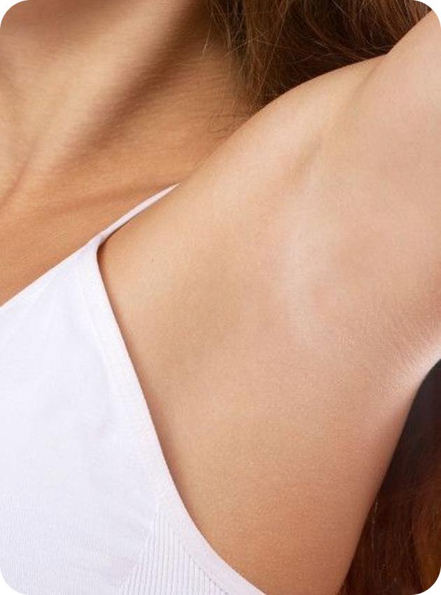 Close-up of a woman's shoulder and neck area in a white top