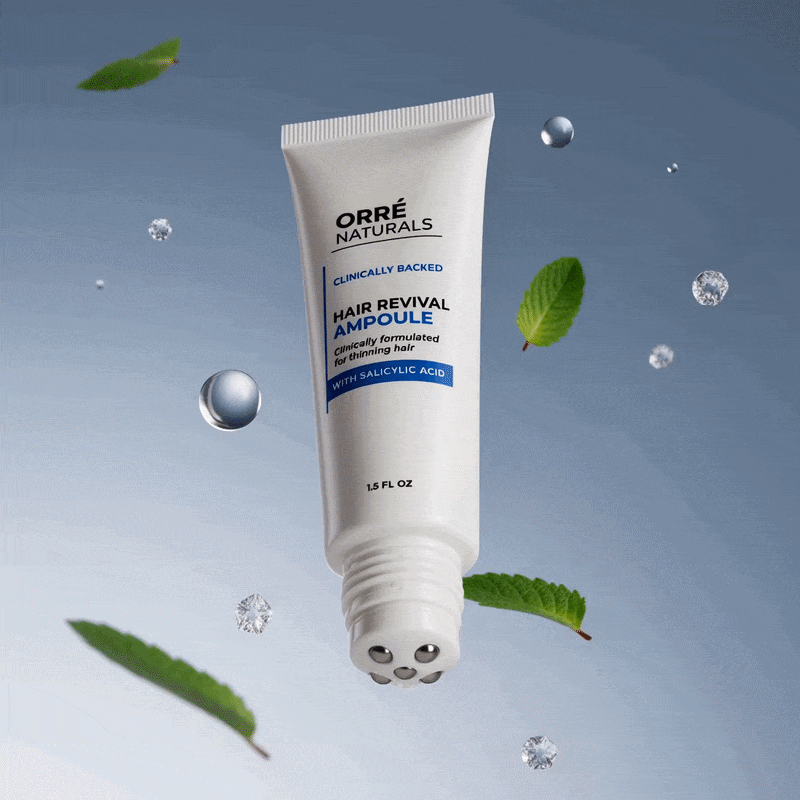 Scalp ampoule tube with green leaves and water droplets