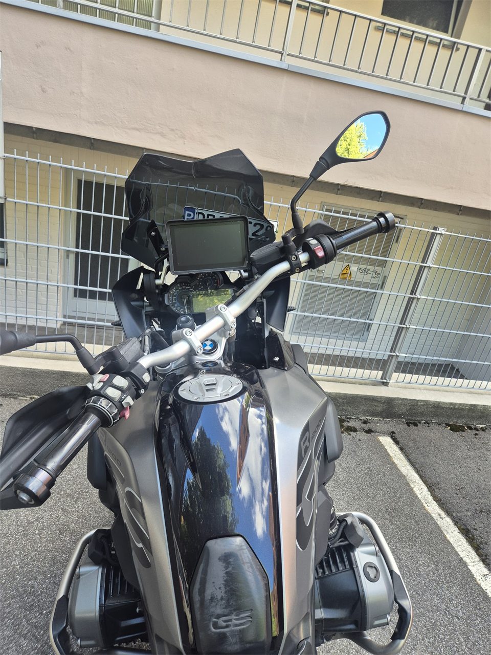 Motorcycle with the display mounted above the dashboard